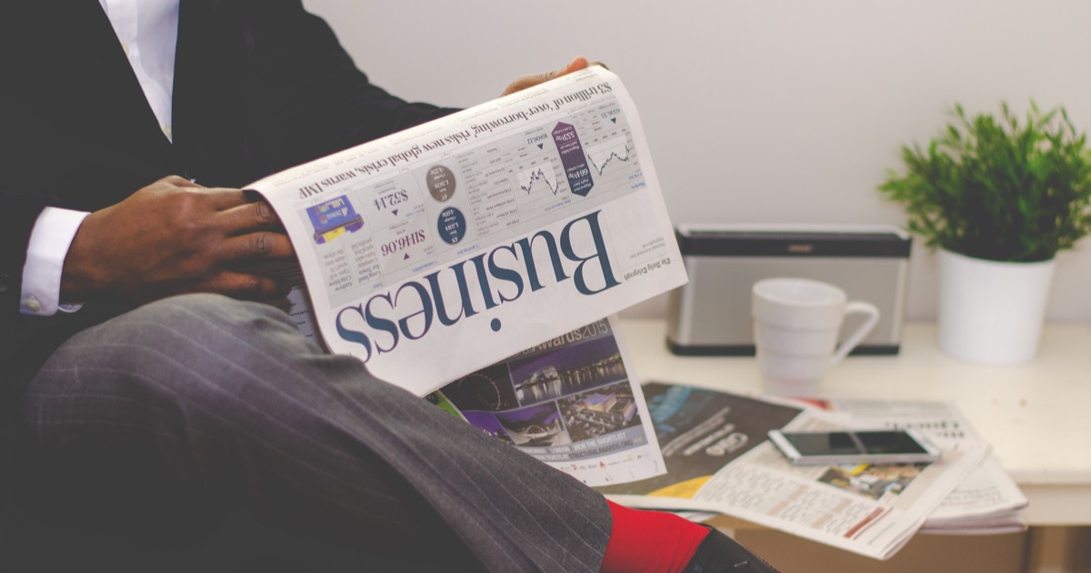 Man Reading Business Newspaper