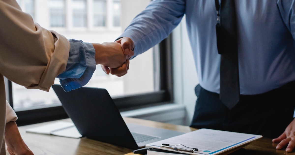 Lawyer shaking hands with client