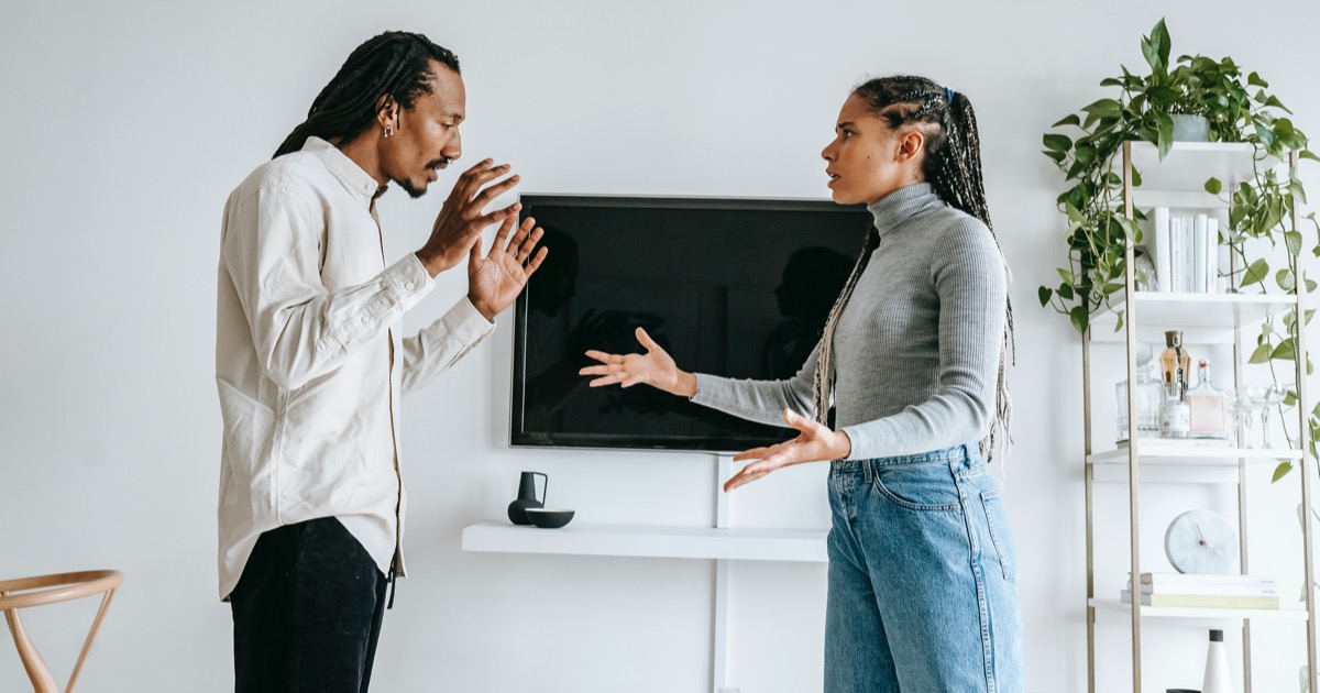 Couple arguing in living room