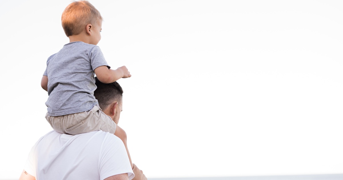 Child on dad's shoulders