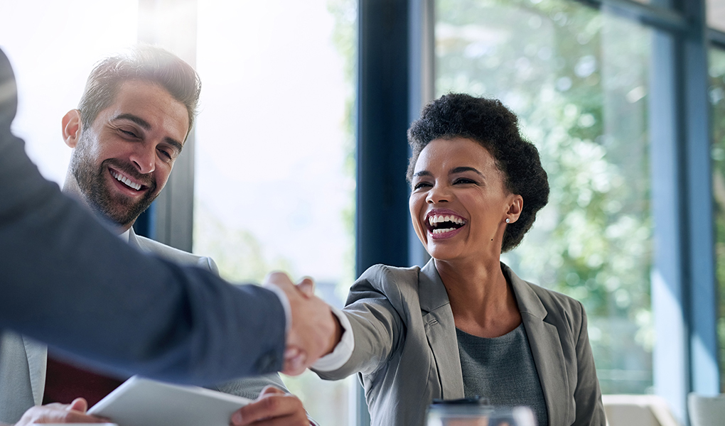 Cropped shot of businesspeople shaking hands during a meeting in an office